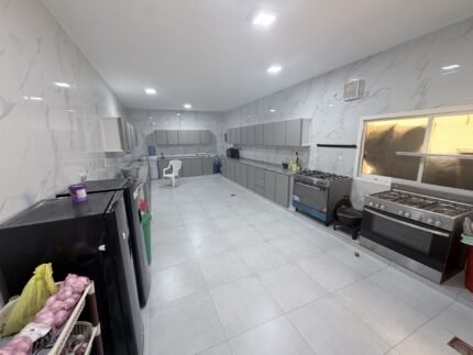 New kitchen with gas range and storage cabinets after full renovation